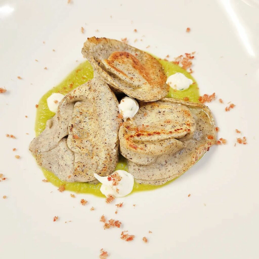 rifrullo Buckwheat tortellini stuffed with sheep ricotta with pea velvet and chive herb yogurt drops